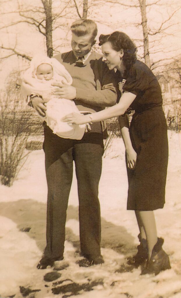old photo of a family with a small child